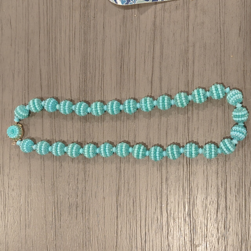Teal vintage costume jewelry.